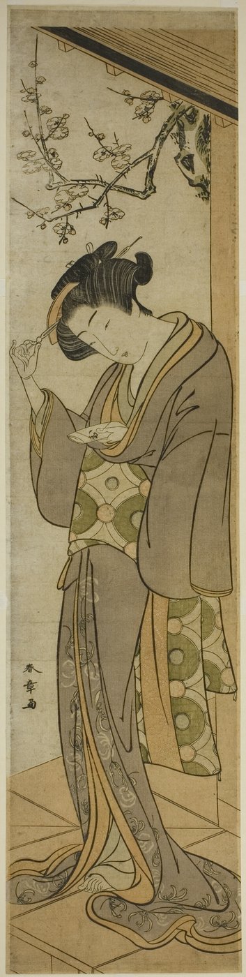 ベランダで手紙を開けようとしている女性 作： Katsukawa Shunsho