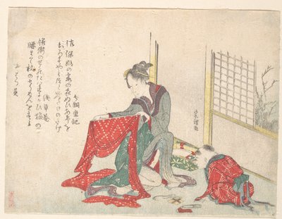 布を畳んでいる女性 作： Katsushika Hokusai
