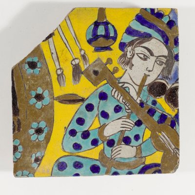 ターバンでフルートを演奏する男性を描いた17世紀後半のSafavid Persia cuerda seca陶器タイル 作： Persian School