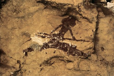ロックアート：女性の狩人先史時代、後期旧石器時代。スペイン、ティオ・ガロッソ洞窟。 作： Prehistoric Prehistoric