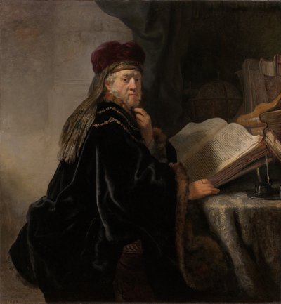 彼の研究で机の学者に着席した学者 作： Rembrandt van Rijn