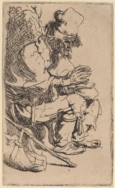 こじき皿で手を温めながら座っている物乞い 作： Rembrandt van Rijn