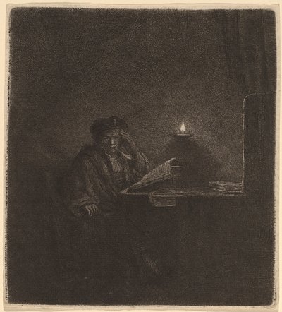 キャンドルライトのそばのテーブルにいる学生 作： Rembrandt van Rijn