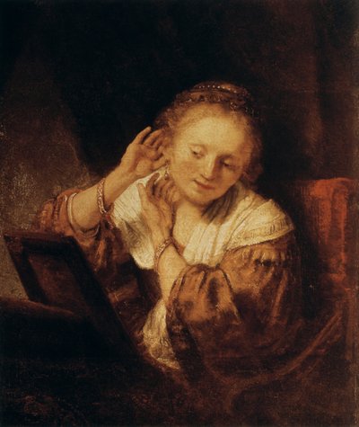イヤリングを持つ若い女性、1657 作： Rembrandt van Rijn