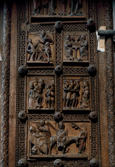 ロマネスク美術：ドイツ・ケルンのカピトルの聖マリア教会（Sankt Maria im Kapitol, Koln）の12世紀中頃の木製扉。羊飼いたちへの告知、キリスト降誕、魔術師の崇拝、キリストの誕生を描いたシーン。 作： Romanesque
