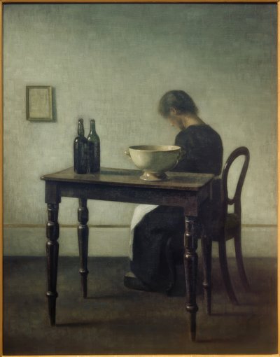 テーブルの後ろに座っている女性 作： Vilhelm Hammershoi