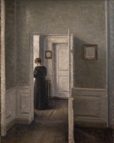 女性が立っているインテリア（油彩・キャンバス 作： Vilhelm Hammershoi