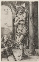 柱のそばに立つ悲しみの男