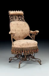 Rococo Revivalは、1850年頃、ニューヨークのAmerican ChairCompanyによって製造された鋳鉄製の求心性アームチェアを塗装および金メッキしました。