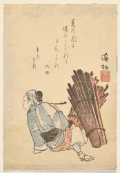 パイプを吸うために一時停止する女性の薪採集者
