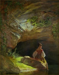 洞窟の前の女の子