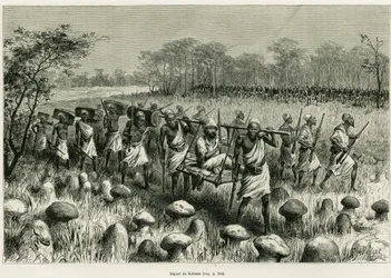 カラッサを出発し、ポーターと一緒に椅子に座っている語り手の旅行者。1883年から1885年にかけて、船のアンサインを務めたVictor Giraud（ヴィクトル・ジロー）が、Edouard C.の指揮の下、1887年のツアー・デュ・モンドに参加した際の物語「Les lacs de l
