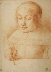 書いたり絵を描いたりする若い女性