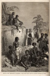 ハワイ諸島の王であり、その部隊の創設者であるカメハメハ1世（1758年頃～1819年）が、ホノルルでハワイの戦士や一部の臣下を取り囲んでいる様子。1855年～69年に行われたサンドイッチ諸島への航海を描いたエミール・バヤールの図面に基づくエングレーヴィングで、C