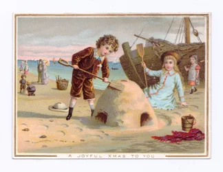 砂浜で砂の城を作る少年を描いたヴィクトリア朝のクリスマスカード、1880年頃（カラーリトグラフ