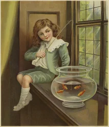 金魚のボウルに釣り竿をぶら下げる少年