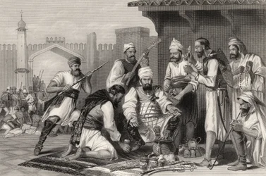 1858年に発行された「インドの反乱の歴史」から、反逆者から取った略奪品を分割するシーク軍