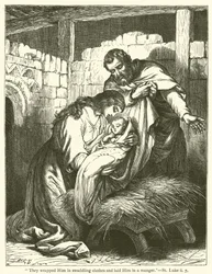 "聖ルカ2章7節「彼らは彼をよだれかけで包み、飼葉おけに寝かせた」（彫刻）。