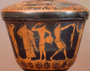 円盤投げなどの種目を行う選手がいるPyxis。チェルヴェテリ（ラツィオ州）の赤像土器。エトルリア文明、紀元前4世紀。