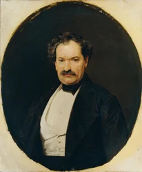 黒いコートに白いチョッキを着た紳士