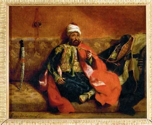 Turk fumant, assis sur un divan - ターク、ディベッドで喫煙...