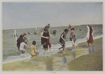 海岸でロープを使って遊ぶ子供たち（カラー写真