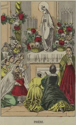 聖母マリアの像の前で祈るカトリック教徒