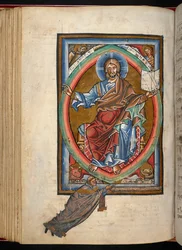 Arundel 156、f.99v、キリストはマンドルラの中に威厳を持って即位し、「段階的、連続的、秘跡的」（ベラム）からの伝道者の 4 つのシンボルに囲まれています。