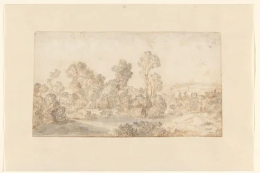 川沿いに背の高い木々が立ち並ぶ丘陵の風景