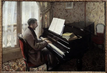 ピアノを弾く若い男性ギュスターヴ・カイユボット（1848-1894）の絵画