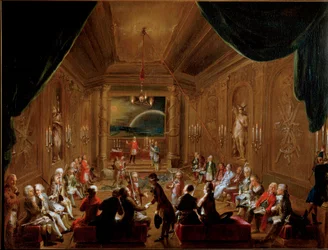 1790年、ウィーンのフリーメーソン・ロッジ「ツア・ゲクレンテン・ホフヌング」の集会。ヴォルフガング・アマデウス・モーツァルト（1756-1791）は右手前に座っている。イグナーツ・ウンターベルガーによる絵画。ウィーン市歴史博物館