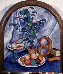 静物。 カメリア（静物。カメリア）。 果物、ペストリー、鉢植えの下に積み上げられた本。 Ilya Ivanovich Mashkov（Ilia Mashkov、Matchkov）（1881-1944）による絵画、キャンバスに油彩