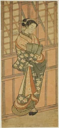 格子窓の前に立つ娼婦