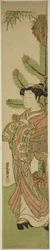 松竹の正月飾りの前の花魁