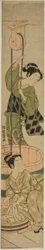 井戸で洗濯をする女性