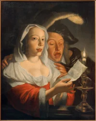 キャンドルライトの下で歌うカップル