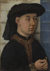リングを保持している若い男、c。 1450