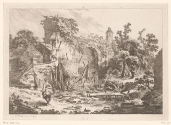 網を張った漁師の家の前の女性