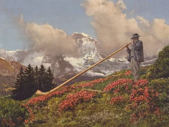 スイス：アルプホルン送風機、背景にユングフラウ（カラー写真）