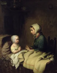 ベッドで彼女の祈りを言っている小さな女の子