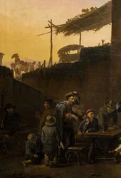イタリアの宿の前で飲む人々