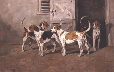 厩舎のドアのそばにいる4匹の猟犬