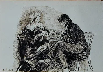 テーブルで読書をする男性と女性