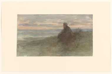 海沿いの砂丘に座っている女性