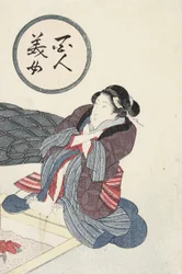 囲炉裏で足を温める女性