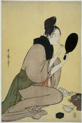 美人画。彼女の唇に化粧を適用する女の子