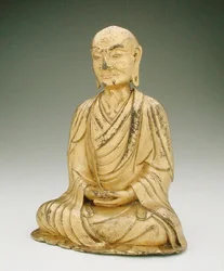 座ったローハンの図（金銅）