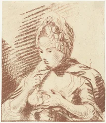 若い母親は赤ちゃんに哺乳瓶を与えます