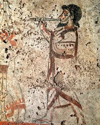 笛を吹く楽士。紀元前4世紀のルカニアのフレスコ画、イタリア、パエストゥムの墓地遺跡出土。パエストゥム国立考古学博物館