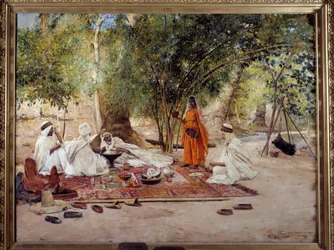 オリエンタリズム：「おもてなしの食事」 アルジェリアのビスクラ近郊にあるチェルマのオアシスでのアラブ人の生活風景を描いたもの。モーリス・ボンパール（1857-1936）による絵画 1891年 マルセイユ、Musee des Beaux Arts